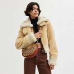 Mira Shoulder Bag In Signature Canvas